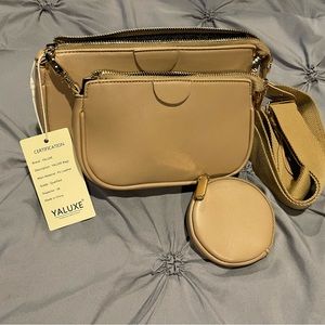 Yaluxe leather crossbody bag. Comes with coin purse and cosmetic bag. NWT